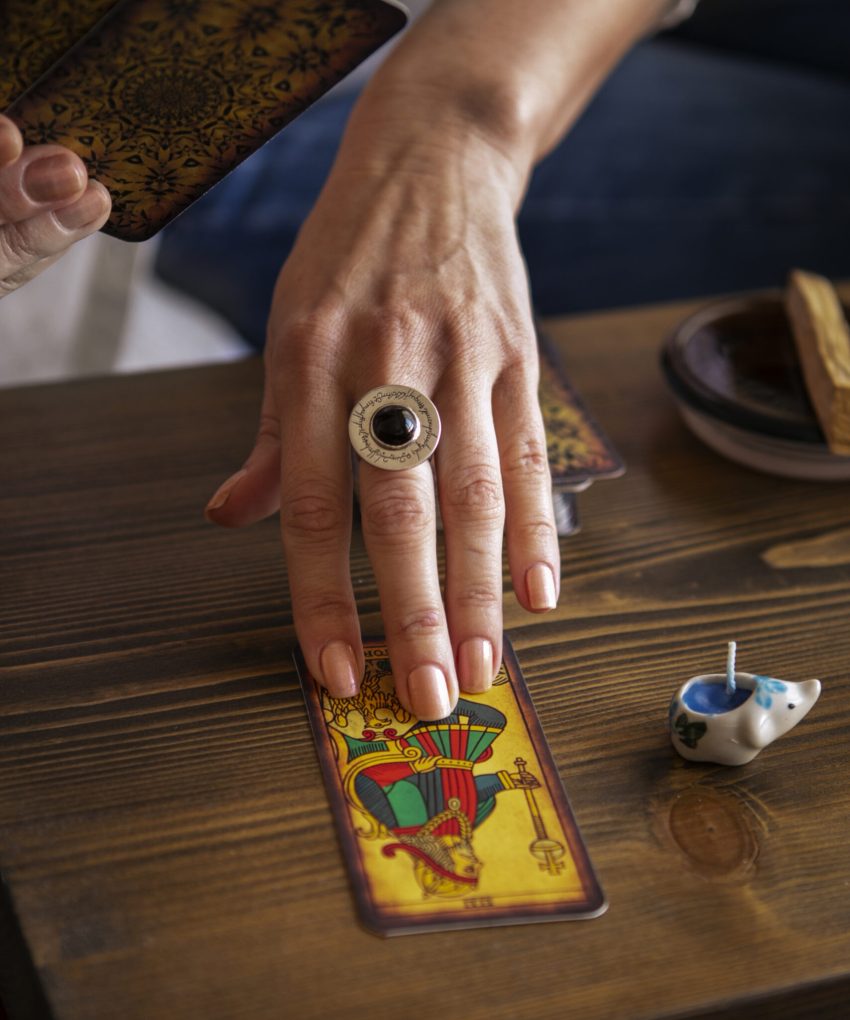 high-angle-woman-reading-tarot